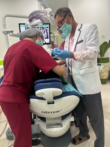 The clinical team treating a patient at Arirang Dental Clinic, Kuningan Jakarta